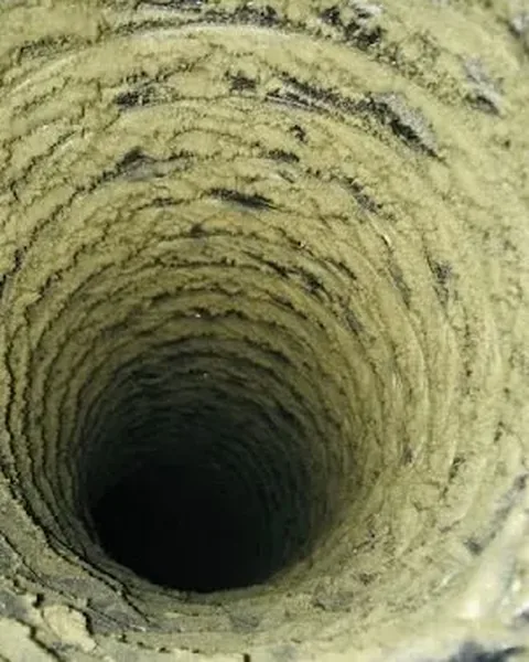 Before: Years of yellow dust buildup in a return duct